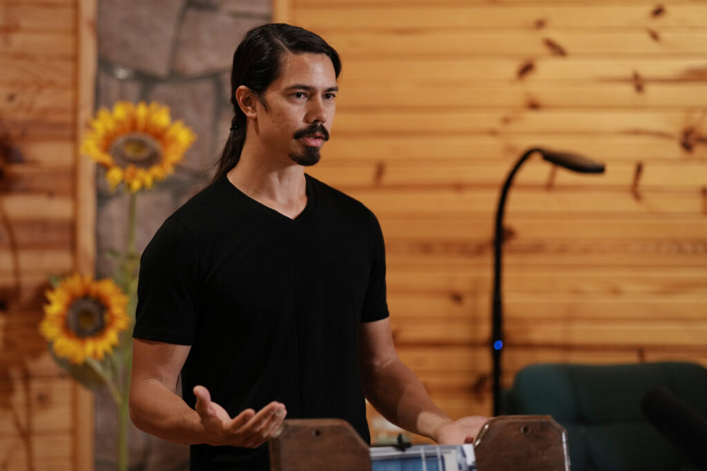 Adam Eurich teaching a group about early Buddhist practices during a meditation talk.